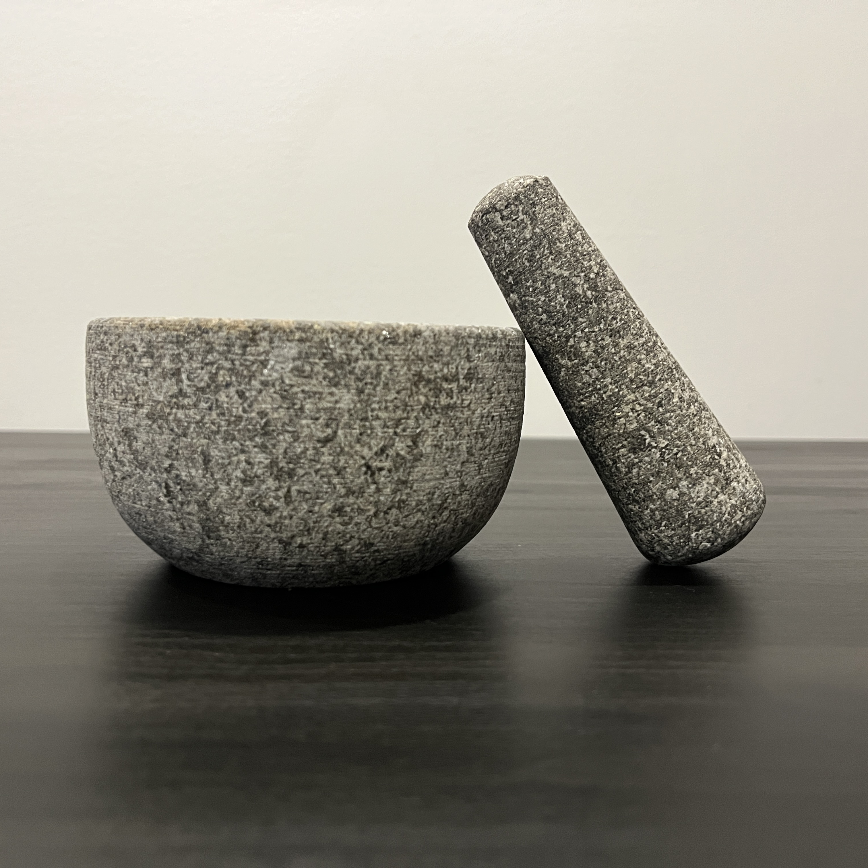 A Mortar & Pestle made from stone.